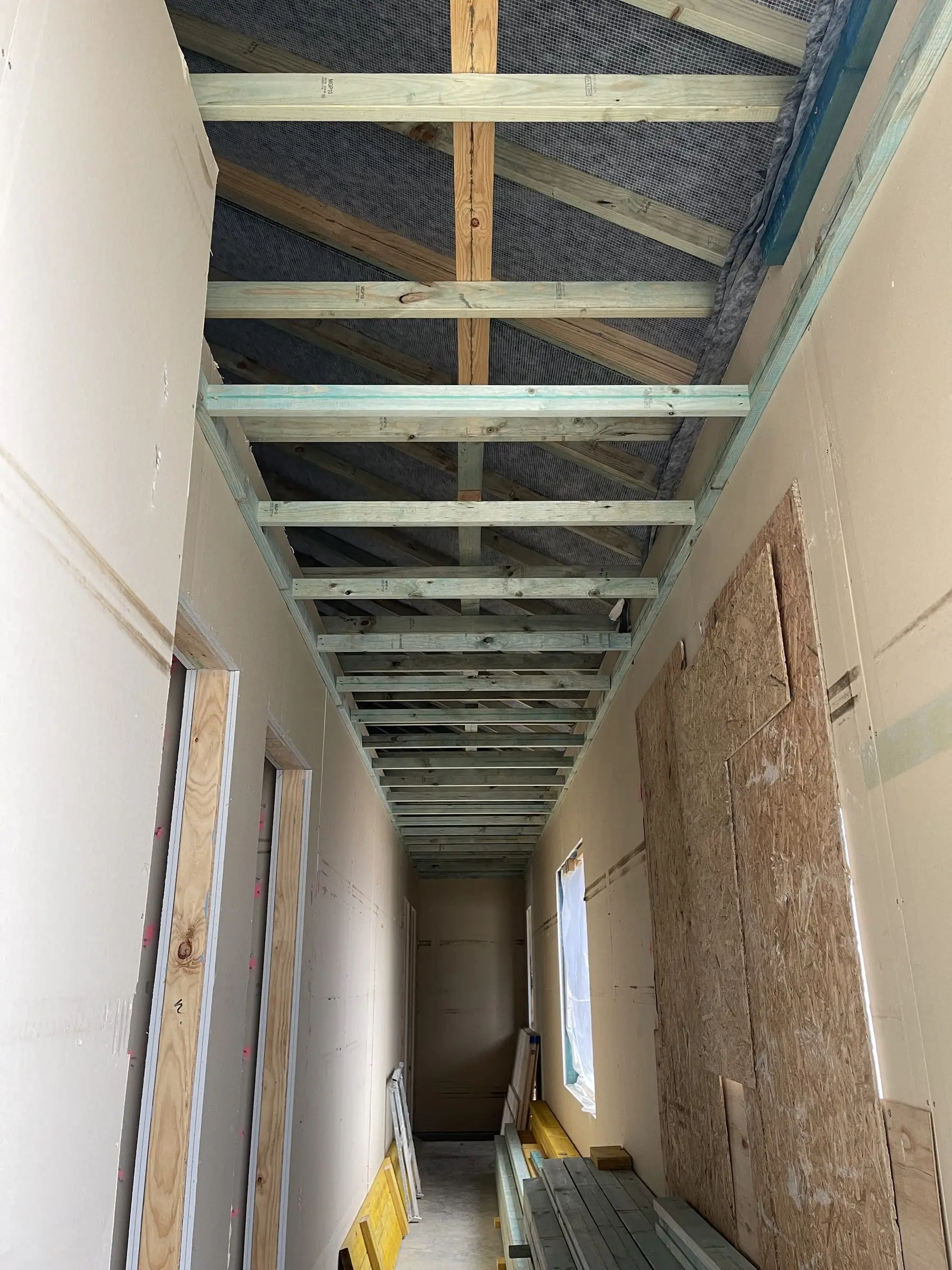 Ceiling lining and steel wall framing during interior fit-out