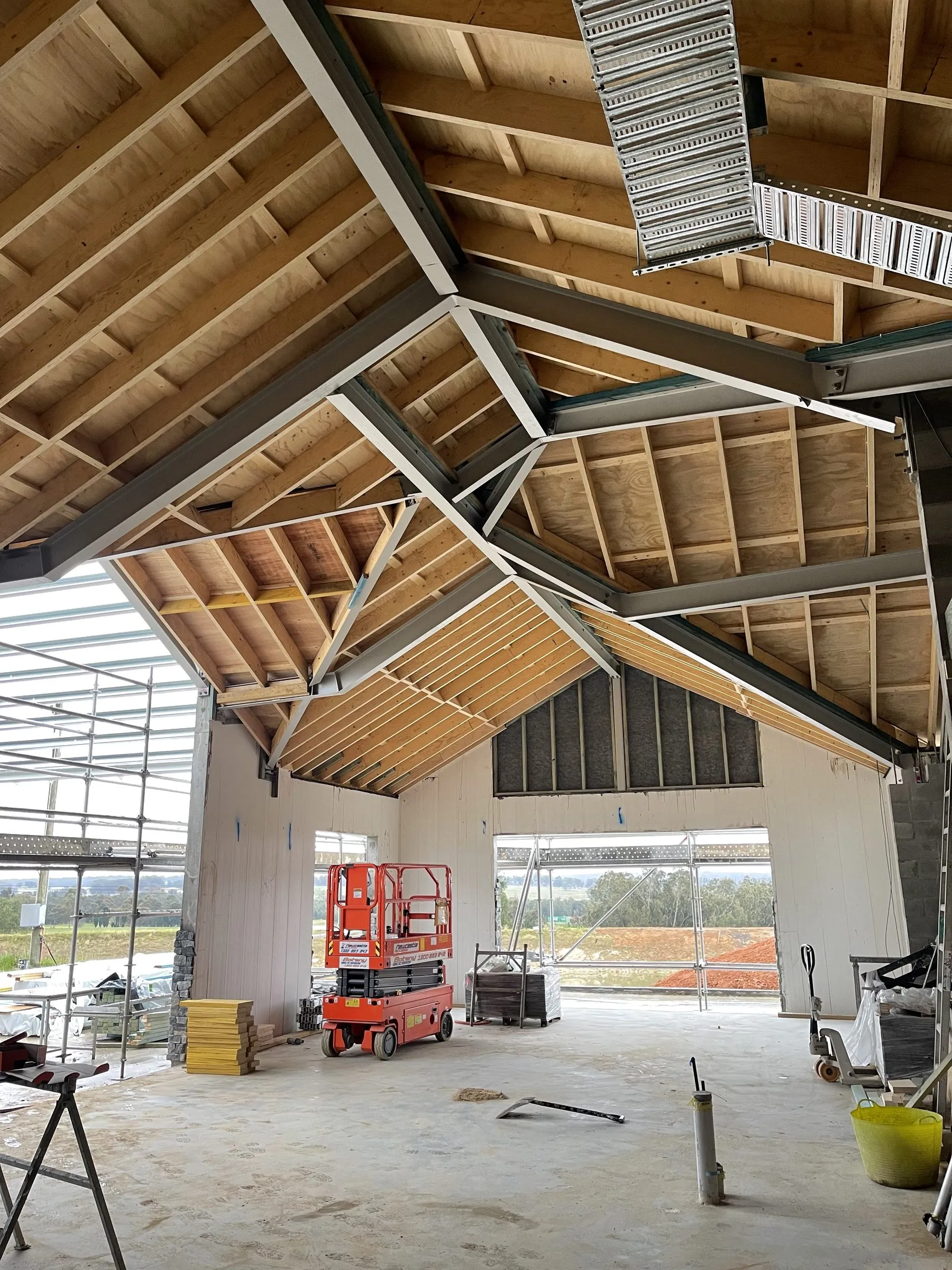 Internal staircase and roof framing under construction on a Newcastle build