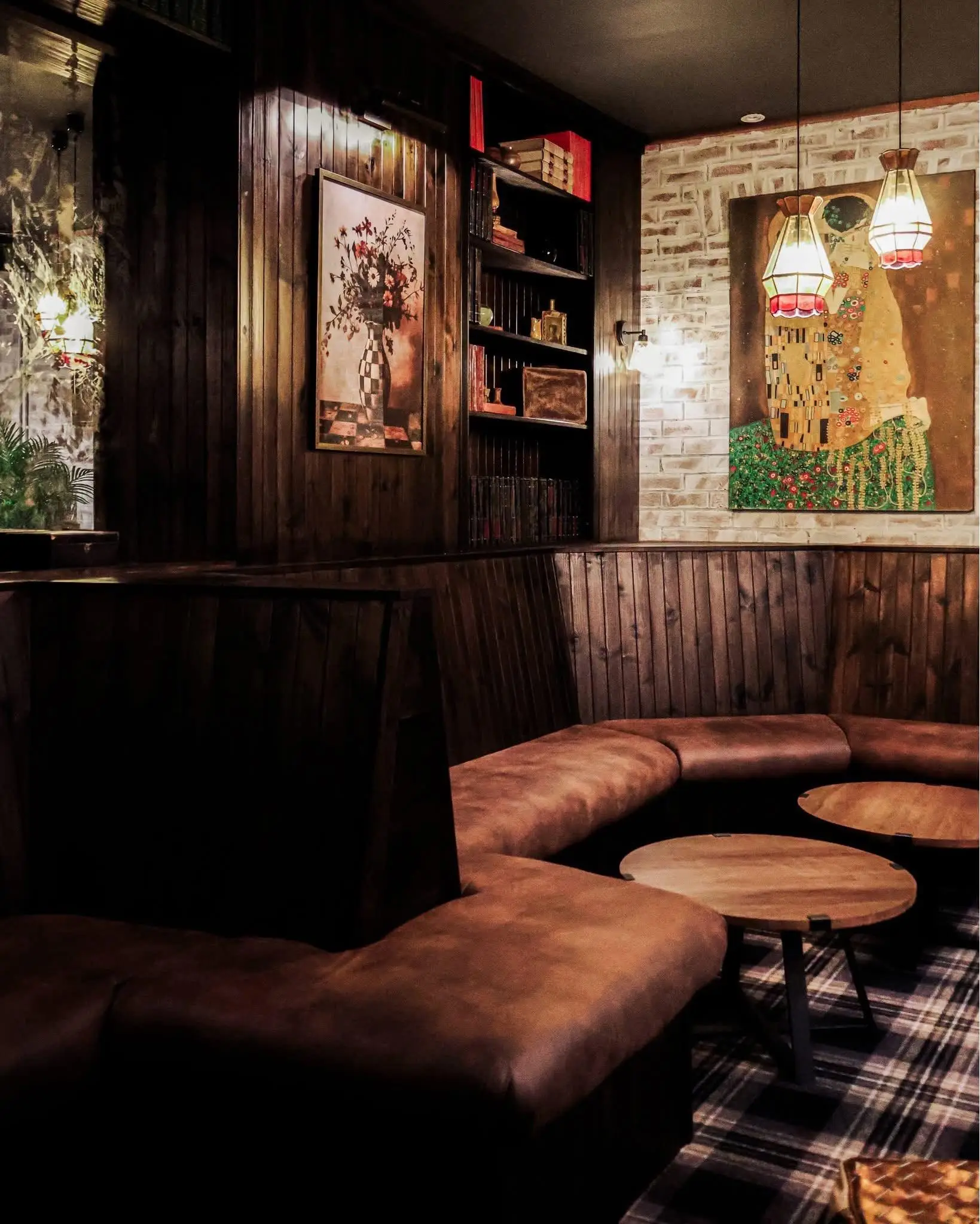 Lounge with a brick feature wall and fitted banquette seating