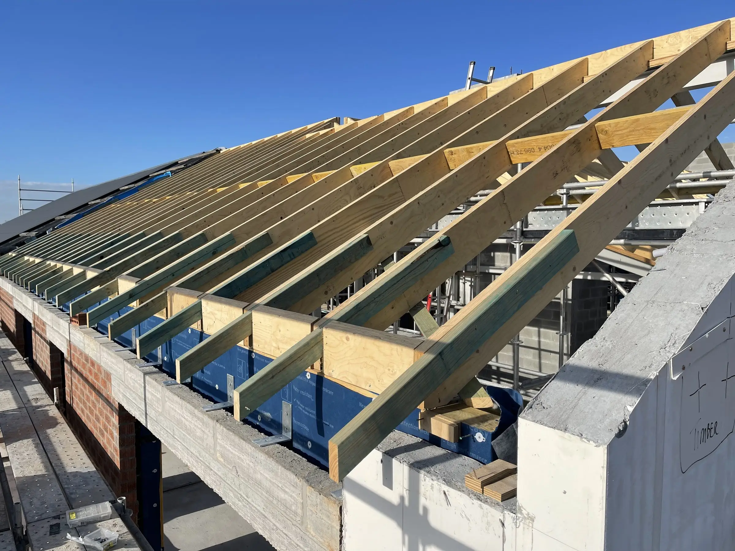 Roof trusses and structural steel beams installed on a new build